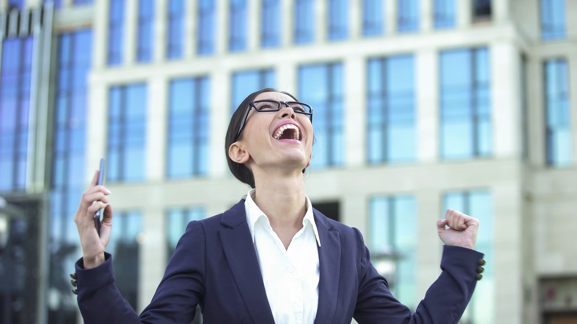 Happy woman after getting a promotion and a salary raise with the advice of her career coach